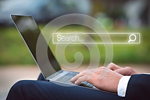 Businessman with laptop searching information in internet. Internet search bar. Online search. Networking concept.