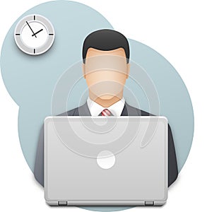 Businessman with laptop. Successful young man dressed in gray business suit working on laptop on wall background with office clock