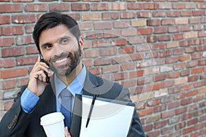 Businessman laughing over a joke on phone call