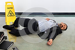 Businessman Laying Injured on the Floor
