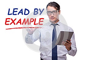 Businessman in lead by example concept