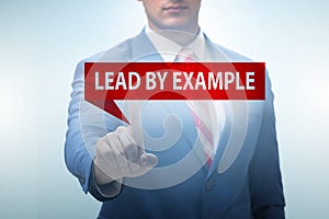 Businessman in lead by example concept