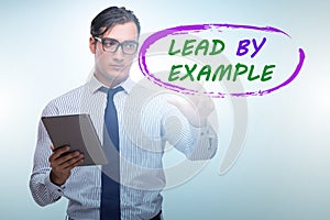 Businessman in lead by example concept