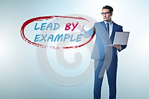 Businessman in lead by example concept