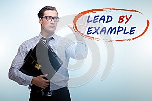 Businessman in lead by example concept