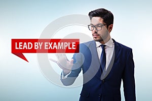Businessman in lead by example concept
