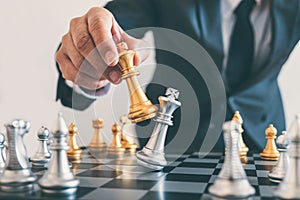 Businessman leadership playing chess and thinking strategy plan