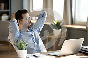 Businessman lean on comfortable office chair resting at workplace