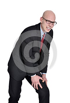 Businessman with leg pain or cramps