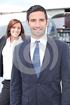 Businessman by a light aircraft