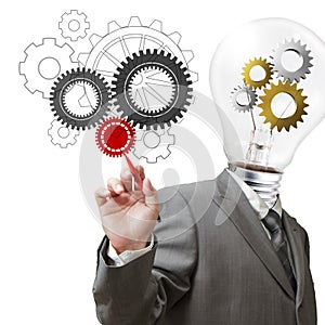 Businessman light bulb head and cogs draws gears