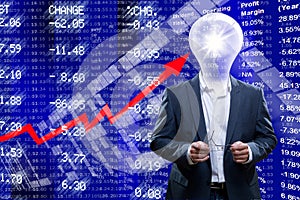 Businessman with a light bulb head in front of Stock Market ticker