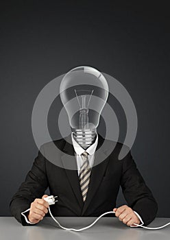Businessman with light bulb head and plug, switch ideas creative