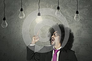 Businessman with light bulbs