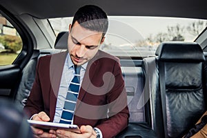 Businessman in limo car