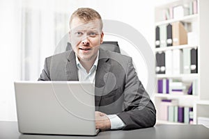 Businessman listening intently to the viewer