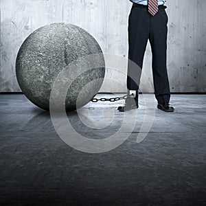 Businessman lock with stone ball