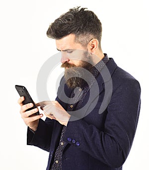 Businessman with long beard and serious face.