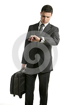 Businessman look his watch with handbag