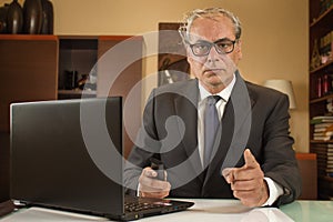 businessman looking ahead and working from home telecommuting due pandemic with laptop