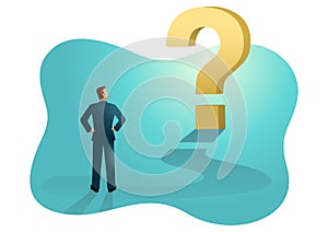 Businessman looking at big question mark