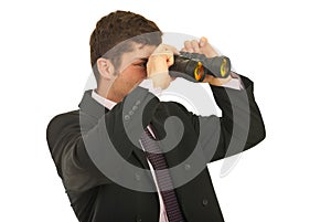 Businessman looking through binocular