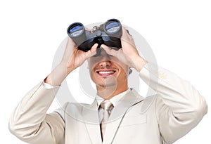 Businessman looking through binoculars