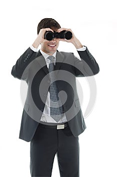 Businessman looking through a binoculars