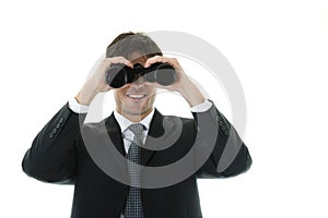 Businessman looking through binoculars