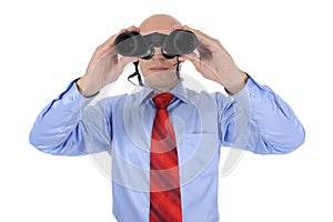 Businessman looking through binoculars