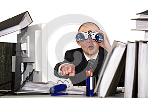 Businessman looking through binoculars