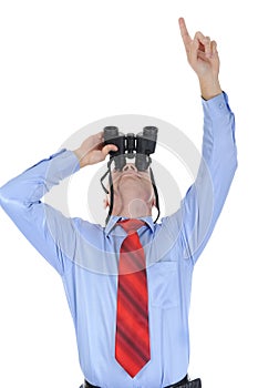 Businessman looking through binoculars