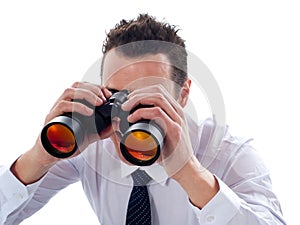 Businessman looking through binoculars