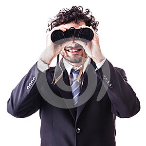 Businessman looking through binoculars