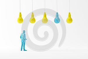 Businessman looking at blue light bulb among yellow light bulbs on white background
