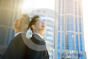 Businessman looking at buildings in the city