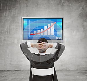 Businessman looking at chart