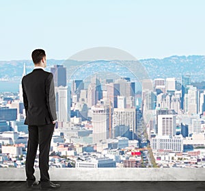 Businessman looking at city