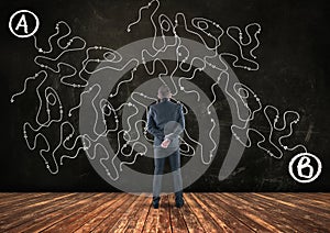 Businessman looking at a complicated path