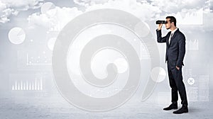 Businessman looking forward with binoculars