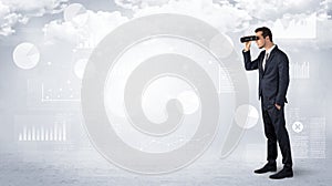 Businessman looking forward with binoculars