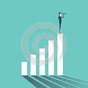 Businessman looking future. Standing on graph