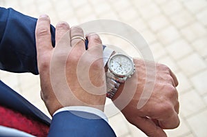 Businessman looking on hand watch