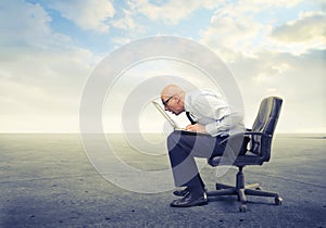 Businessman looking at his laptop too close