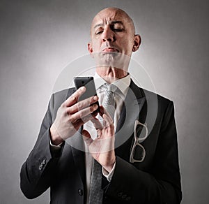 Businessman looking at his phone