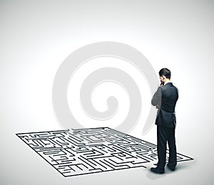 Businessman looking at labyrinth