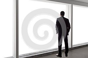 Businessman Looking Out a Big Window