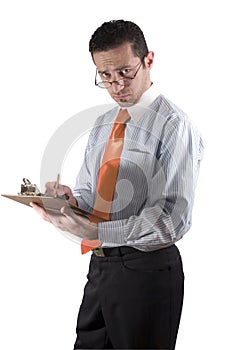 Businessman looking over his glasses with clipboard on hand - fr