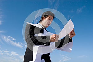 Businessman looking over paperwork