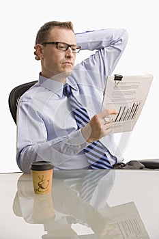 Businessman Looking at Paperwork - Isolated